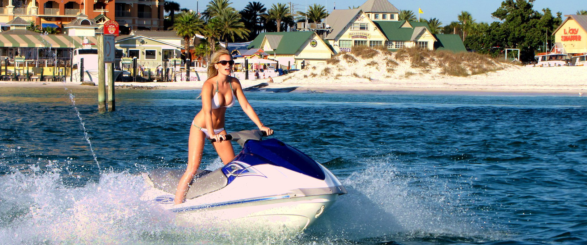 a woman riding a jet ski in fort walton beach