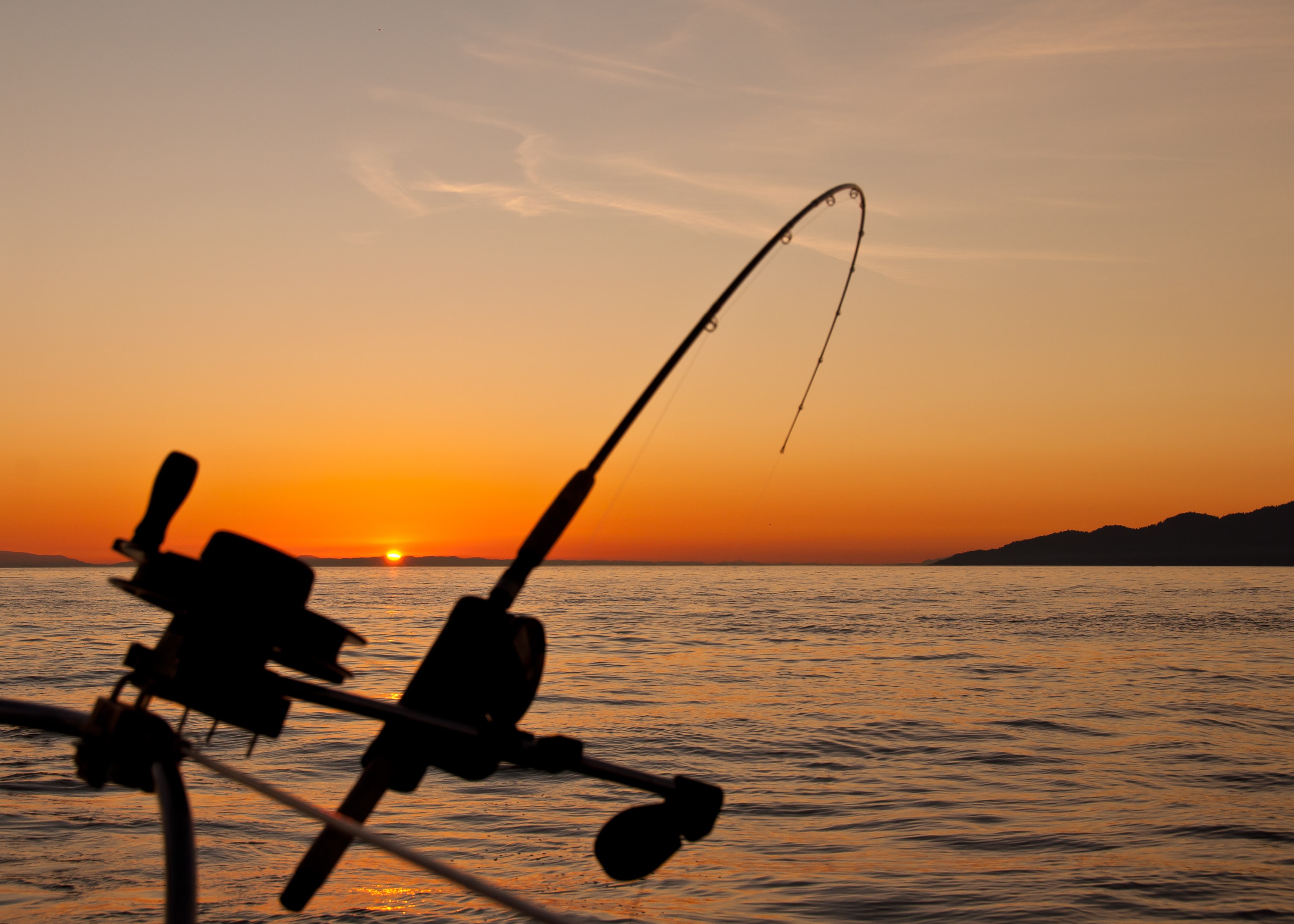 fishing rod in sunset. destin fort walton beach